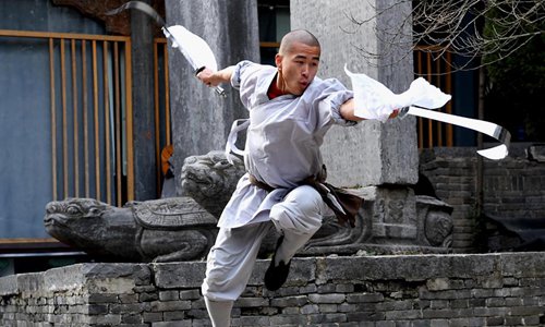 A monk practices martial arts at Shaolin Temple in central China's Henan Province, Jan. 21, 2017. Photo:Xinhua