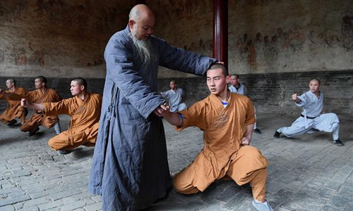 Monks practice martial arts at Shaolin Temple in central China's Henan Province, Jan. 20, 2017.Photo:Xinhua