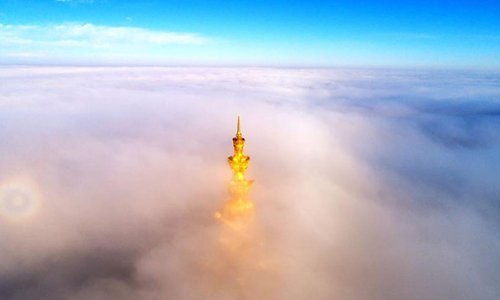 Mount Emei in southwest China’s Sichuan Province is shrouded in ethereal-like sea of clouds recently, giving tourists there a spectacular view. An aerial photo shows the golden peak of the Buddhist statue on the mountain peeking through the clouds, giving the illusion that it’s floating there in the sky.Photo: Chinanews.com