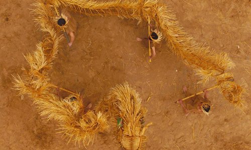 Performers wave a straw dragon in Dahan Village of Hancun Township in Qingfeng County, central China's Henan Province, Feb. 14, 2017. The local straw dragon dance was a pray for rain in ancient time and turned into a folk art nowadays.Photo:Xinhua