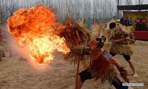 Performers play the dance of straw dragon in Dahan Village of Hancun Township in Qingfeng County, central China's Henan Province, Feb. 14, 2017. The local straw dragon dance was a pray for rain in ancient time and turned into a folk art nowadays. Photo:Xinhua