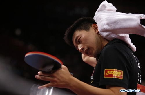 Ma Long of China reacts during the semifinal of men's singles against his teammate Wang Hao at the 2013 World Table Tennis Championships in Paris, France on May 19, 2013. Ma lost 2-4. (Xinhua/Wang Lili) 