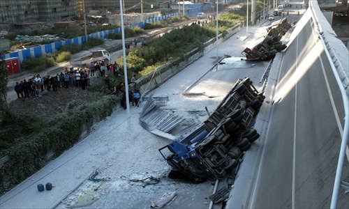 Onlookers gather at the scene of the bridge collapse in Harbin. Photo: CFP