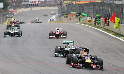 Sebastian Vettel of Germany leads the pack during the Brazilian Formula One Grand Prix on November 24 in Sao Paulo, Brazil.