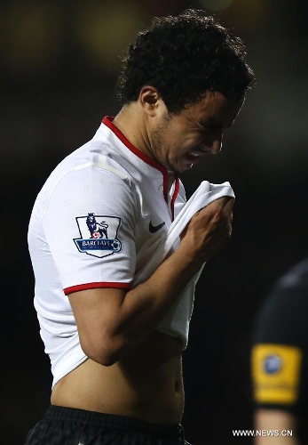 Rafael Da Silva of Manchester United leaves the pitch after the Barclays Premier League match between West Ham United and Manchester United at Upton Park in London, Britain, on April 17, 2013. The match ended with a 2-2 draw. (Xinhua/Wang Lili) 