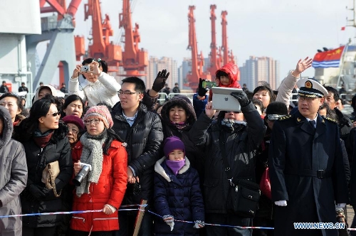 Family members and friends of a Chinese flotilla's crew members bid farewell to the flotilla, which will depart for the Gulf of Aden and the sea off Somalia to conduct escort missions, at a port in Qingdao City, east China's Shandong Province, Feb. 16, 2013. The flotilla, as the 14th batch of its kind to engage in escort missions, consists of a missile destroyer and a frigate as well as a supply ship which are all from the North Sea Fleet of the People's Liberation Army (PLA) Navy. (Xinhua/Li Ziheng) &nbsp;