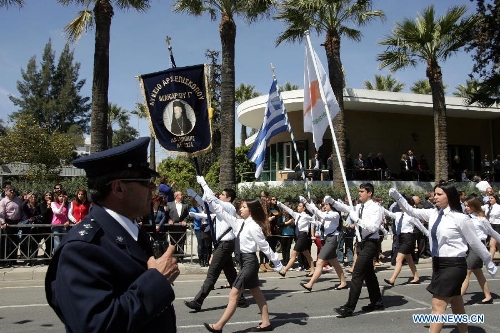 Cypriots parade in Nicosia on March 25, 2013, to mark the 192nd anniversary of Greece's Independence Day, hours after Eurozone ministers approved a new bailout plan for Cyprus. With about 80 percent of its population being Greek Cyprus, Cyprus and Greece enjoy extremely close relationship. (Xinhua/Marios Lolos) 