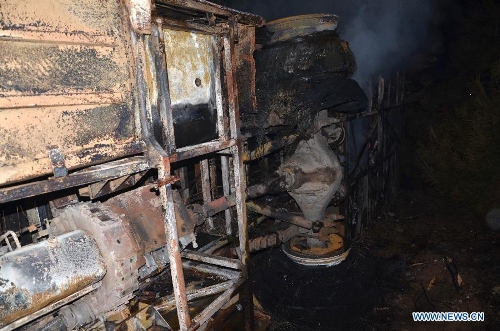 Photo taken on Feb. 1, 2013 shows the damaged bus after an accident occured in Ningxian County of Qingyang city, in northwest China's Gansu Province.  (Xinhua/Wang Zhaofeng) 