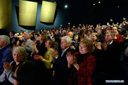 Audience enjoy Peking opera at the Lucent Danstheater in Hague, the Netherlands, May 21, 2013. Peking Opera Theater of Beijing started its European tour in Hague on Tuesday. It will also perform in Linz of Austria and Milan of Italy. (Xinhua/Jin Liangkuai) 