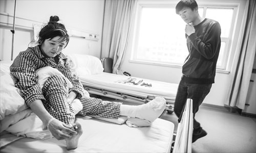 Guo Ping, a former marathon champion, received free medical treatment at Beijing Mary's Orthopedic Hospital. Photo: Li Hao/GT