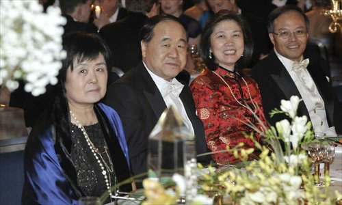 Chinese writer and Nobel Prize in Literature winner Mo Yan (2nd L) and his wife Du Qinlan (1st L), Chinese Ambassador to Sweden Lan Lijun (1st R) and his wife Gu langlin (2nd R) attend an evening reception after Mo received Nobel Prize in Literature from Sweden's King Carl XVI Gustaf at the 2012 Nobel Prize ceremony in Stockholm, Sweden, December 10, 2012. Photo: Xinhua
