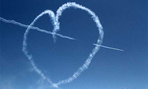 Acrobatic Yakkers and Jurgis Kairys perform in a formation of two YAK 52 and one SU 31 at the Bucharest International Air Show & General Aviation Exhibition (BIAS 2012) at the Bucharest Baneasa-Aurel Vlaicu International Airport in Bucharest, capital of Romania, July 21, 2012.  Photo: Xinhua