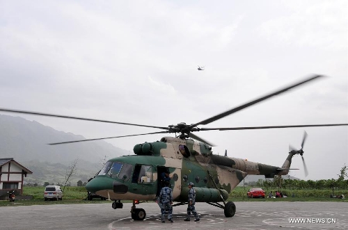 A helicopter of the People's Liberation Army Air Force (PLAAF) transports relief material at Lushan County in quake-hit Ya'an, southwest China's Sichuan Province, April 20, 2013. As of 4:00 p.m. Beijing time (GMT 0800), the PLAAF deployed 10 sorties of transport planes and helicopters for various rescue and relief work, including aerial photography, transporting and disaster situation reconnaissance. (Xinhua/Huang Shubo)