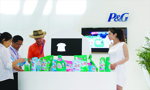 Visitors look at P&G's detergent products during a trade show in Beijing in May. Photo: CFP
