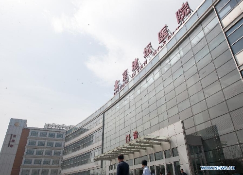 Photo taken on April 13, 2013 shows the Beijing Ditan Hospital, where a seven-year-old girl in Beijing infected with the H7N9 strain of bird flu is being treated, in Beijing, capital of China. This was the first such case in the Chinese capital. The child is in stable condition. Two people who have had close contact with the child have not shown any flu symptoms, and the girl's parents were engaged in live poultry trading in a township of Shunyi District in Beijing's northeastern suburbs. (Xinhua/Zhang Yu)