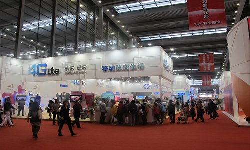Visitors at the TD-LTE area of the Shenzhen Hi-Tech Fair on November 17. Photo: Li Qiaoyi/GT