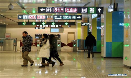 Passengers are seen at the Songjiazhuang Transfer Station linking different subway lines in Beijing, capital of China, December 30, 2012.