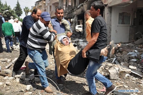 Photo taken on May 11, 2013 shows the site of an explosion in the town of Reyhanli, in the southern Turkish province of Hatay. At least 40 people were killed and 100 others injured after explosions shook a Turkish town on Saturday near the border with Syria, Turkish Interior Minister Muammer Guler said. (Xinhua/NTV) 