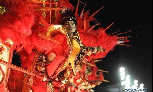 Revelers participate in the annual carnival samba parade in Rio de Janeiro, Brazil, Feb. 10, 2013. The 2013 Rio carnival samba parade began on Sunday. Photo: Xinhua