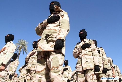 &nbsp;Libyan soldiers demonstrate their skills during a celebration for the second anniversary of the uprising that toppled the regime of strongman Muammar Gaddafi in the Tajoura area in the Libyan capital Tripoli, on Feb. 17, 2013. (Xinhua/Hamza Turkia) 