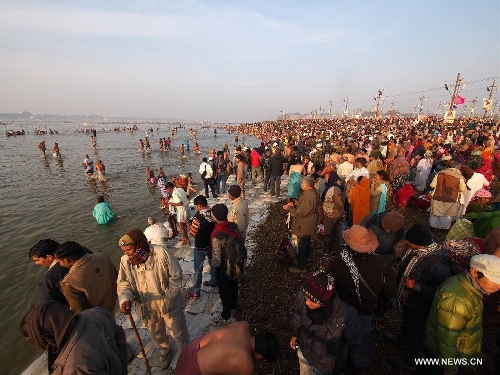 Indian devotees take bath in Triveni Sangam during Maha Kumbh Mela festival in Allahabad, a city in west uttar Predash, India, Jan. 27, 2013. (Xinhua/Li Yigang) 