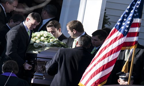 Loved ones on Wednesday carry a casket with the remains of Victoria Soto from Lordship Community Church after a funeral for the slain teacher in Stratford, Connecticut. Soto was one of six adults in addition to 20 children who were killed at Sandy Hook Elementary School. Photo: AFP
