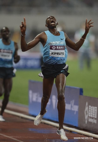 Kenya's Conseslus Kipruto celebrates after winning the men's 3000 meters steeplechase during the IAAF Diamond League Athletics meet in Shanghai, east China, May 18, 2013. Conseslus Kipruto won the first place of the event in 8 minutes and 1.16 seconds.(Xinhua/Li Jundong) 