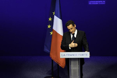 France's President and Union for a Popular Movement(UMP) party's candidate Nicolas Sarkozy delivers a speech conceding defeat to his Socialist challenger Francois Hollande in Sunday's presidential runoff at a rally in Paris, France, May 6, 2012. Photo: Xinhua