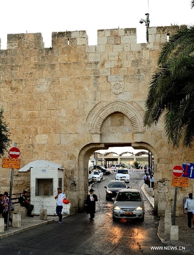 This photo taken on July 3, 2013, shows the Dung Gate of Jerusalem's Old City. Old City of Jerusalem and its Walls were recorded on the United Nations Educational, Scientific and Cultural Organization's World Heritage list in 1982. (Xinhua/ Yin Dongxun)