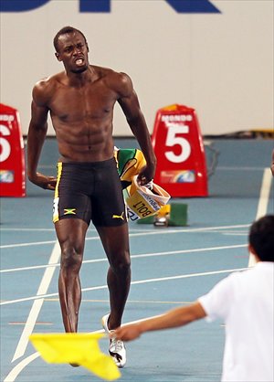Inset: Usain Bolt reacts after he was disqualified in the men's 100m final at the IAAF World Championships in Daegu on August 28, 2011.Photo: IC