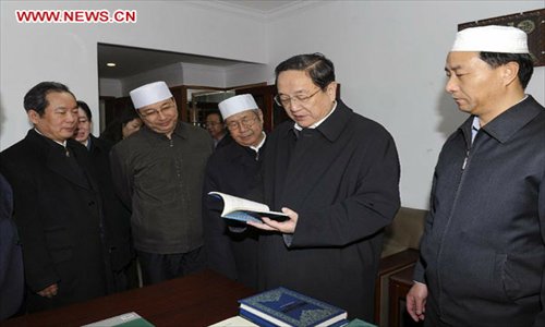 Yu Zhengsheng (2nd R), a member of the Standing Committee of the Political Bureau of the Communist Party of China (CPC) Central Committee, visits China Islamic Association in Beijing, capital of China, January 22, 2013. Yu visited national religious groups in Beijing from January 21 to 23. (Xinhua/Rao Aimin)