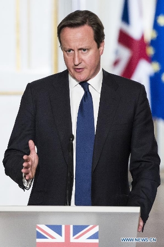 Visiting British Prime Minister David Cameron attends a joint press conference with French President Francois Hollande (not in the picture) at the Elysee Palace in Paris, France, May 22, 2013. French President Francois Hollande and British Prime Minister David Cameron on Wednesday condemned the assassination of a British soldier in the suburbs of London after their meeting in Paris. (Xinhua/Etienne Laurent)