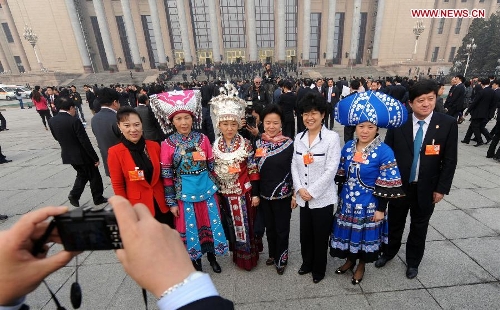 Deputies to the 12th National People's Congress (NPC) pose for a photo in front of the Great Hall of the People in Beijing, capital of China, March 17, 2013. The closing meeting of the first session of the 12th NPC will be held in Beijing on Sunday. (Xinhua/Yang Qing)