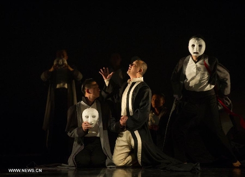 Actor Yao Lu (C) performs during the stage drama 