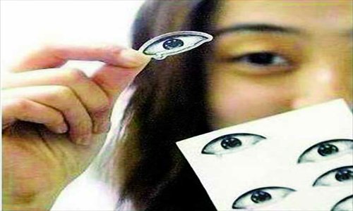 Eye-shaped stickers are a hot item these days, as they can be used to fool others when you're secretly taking a nap. Photo: Chongqing Commercial Daily