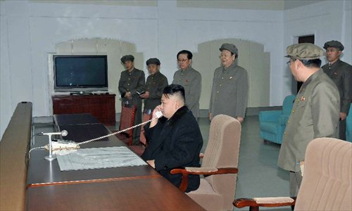 This photo provided by KCNA on Dec. 14, 2012 shows Kim Jong Un (C), top leader of the Democratic People's Republic of Korea (DPRK), gives the launch order of Kwangmyongsong-3 satellite at the Pyongyang General Satellite Control Command Center on Dec. 12, 2012. Kim Jong Un personally commanded Wednesday's satellite launch and observed the whole launching process, the official news agency KCNA reported earlier Friday. Photo: Xinhua