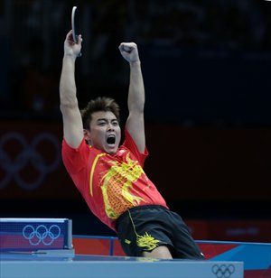 Wang Hao celebrates winning the gold medal.