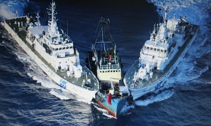 A screenshot of a picture on Yomiuri Shimbun's website shows a fishing boat carrying activists from the Hong Kong based 