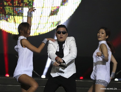 South Korean singer Psy dances as he sings his hit single 