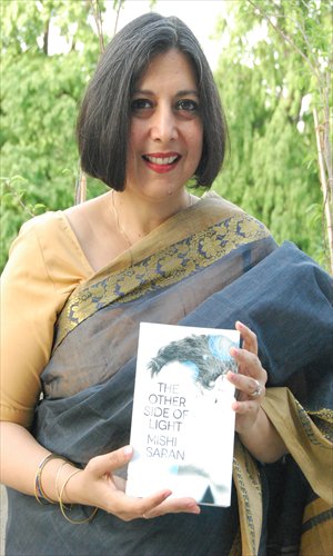 Mishi Saran poses with her latest book The Other Side of Light. Photos: Courtesy of Mallika Roy