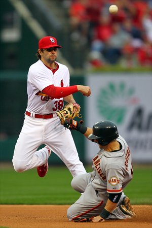 Pete Kozma (No.38) of the St. Louis Cardinals turns a double play as Marco Scutaro of the San Francisco Giants is out at second base. Photo: AFP