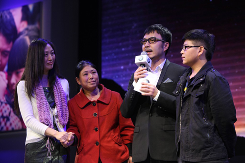 Shi Shaokun (far right), beneficiary of the Warm Heart Fund, meets mentor Luo Xiaomin (far left). Photo: Courtesy of BMW