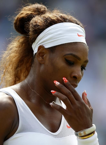 Serena Williams of the United States gestures during the second round of ladies' singles against Caroline Garcia of France on day 4 of the Wimbledon Lawn Tennis Championships at the All England Lawn Tennis and Croquet Club in London, Britain on June 27, 2013. Serena Williams won 2-0. (Xinhua/Wang Lili) 