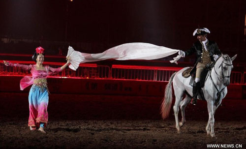 A horseman stages an equestrian performance at the opening ceremony of the second Ordos Dalate International Horse Culture Festival in Dalate Banner of Ordos, north China's Inner Mongolia Autonomous Region, August 25, 2012. Some 60 horsemen from 15 countries and regions gave performances at the festival's opening ceremony Saturday night. Photo: Xinhua