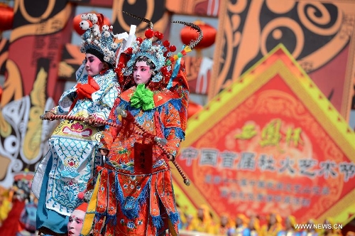 Performers take part in a Shehuo parade in Longxian County, northwest China's Shanxi Province, Feb. 22, 2013. The performance of Shehuo can be traced back to ancient rituals to worship the earth, which they believe could bring good harvests and fortunes in return. Most Shehuo performances take place around traditional Chinese festivals, especially the Spring Festival and the Lantern Festival. (Xinhua/Li Yibo) 
