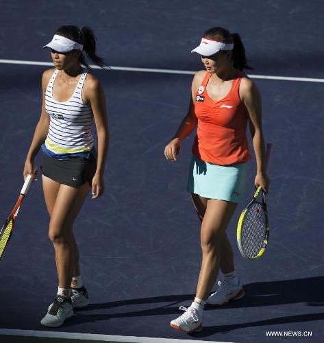 Hsieh Su-Wei (L) of Chinese Taipei and Peng Shuai of China react during the women's doubles semifinal match against Nadia Petrova of Russia and Katarina Srebotnik of Slovenia in the BNP Paribas Open in Indian Wells, California, March 14, 2013. Petrova and Srebotnik won 2-0 to enter the final. (Xinhua/Yang Lei) 