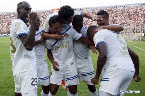 Players of Olimpia celebrate their victory against Real Sociedad after the final match of Honduran Soccer Clousure Tournament, held at Tegucigapa's National Stadium, in Tegucigalpa, Honduras, on May 19, 2013. (Xinhua/Rafael Ochoa)