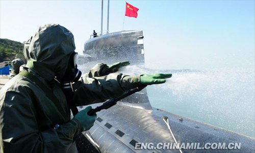 China’s first maritime CBRN (chemical, biological, radiological or nuclear) emergency rescue team under a submarine base of the North China Sea Fleet of the Navy of the Chinese People’s Liberation Army (PLAN) recently conducted the drill on such subjects as real-time monitoring, delineation of contaminated areas, sample collection and analysis, and decontamination of contaminated equipment, personnel and ground with new-type equipment in a sea area. (Chinamil.com.cn/ Yu Hang and Yu Haitao)