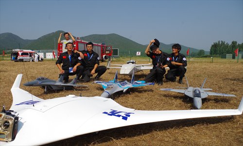 Liu Yang and his team pose with their drones.
Photo: Courtesy of Chen Xiao