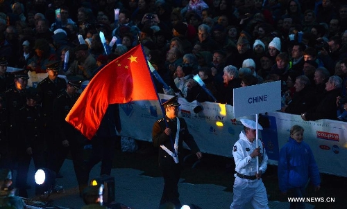 Delegation of the Chinese People's Liberation Army enter the stadium during the opening ceremony of 2nd International Military Sports Council(CISM) World Winter Games at Annecy, France, March 25, 2013. (Xinhua/Wang Siwei) 